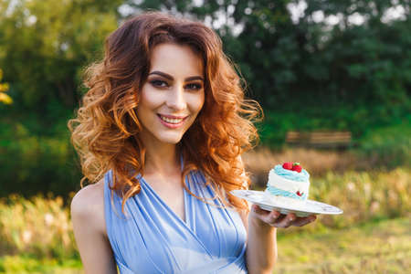 cute bridesmaid eats wedding cake on the wedding ceremonyの写真素材