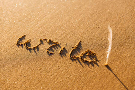 The inscription on the sand. Write concept. Write while you can. Life is so short.の写真素材