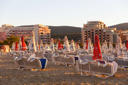 NESSEBAR, BULGARIA - SEP 02, 2016: Beach umbrellas and sun loungers on a beach at sunrise in Nessebar, Bulgaria at September 02, 2016のeditorial素材