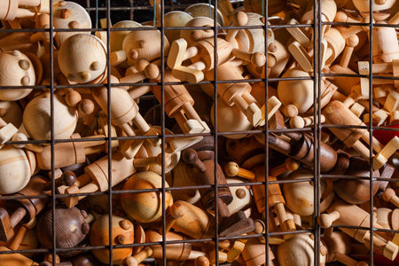 Wooden toys over metal bars. Concept image.の写真素材