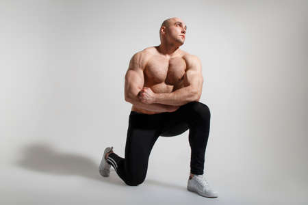 Young sexy muscular man posing on white background の写真素材