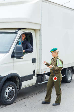 Grodno, Belarus - November 15, 2013: A female border guard checks the documents on Belarusian-Polish border lineのeditorial素材