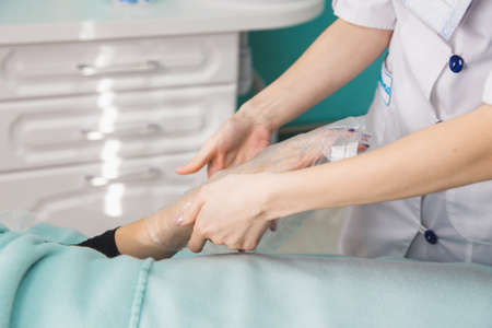 beautician causes treatment cream for the patientの写真素材