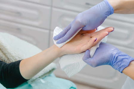 beautician causes treatment cream for the patientの写真素材