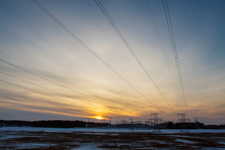 Electrical substation. Winter photo on sunset backgroundの写真素材