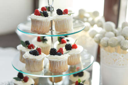 Candy bar. Table with sweet candies. Wedding cakeの写真素材