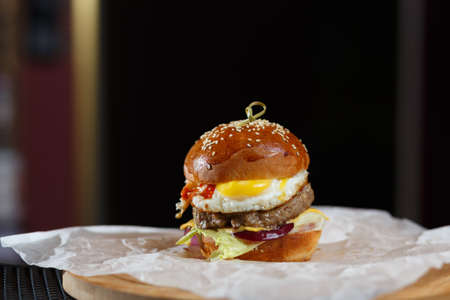 Fresh burger on paper. Close up photo.の写真素材