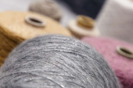 Colorful yarn on spool at the knitting factory.  Yarn on tube, cotton, wool, linen thread.の写真素材