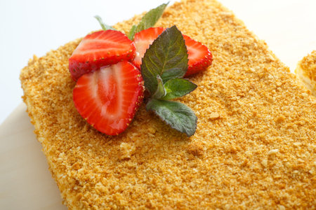 BIg puff pastry decorated with strawberry isolated on a white background, close-up