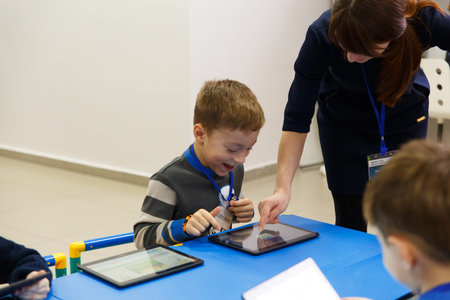 Grodno, Belarus - January 13, 2019: School kids using digital tablet in classroom at the school of...