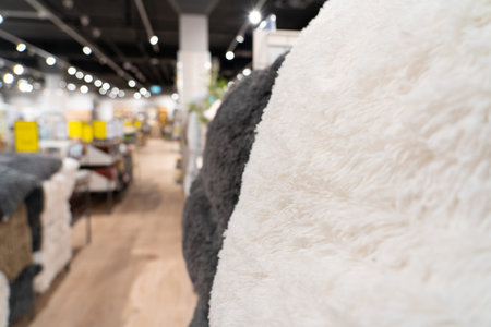 Abstract blur background furniture store on sale - can use to display or montage on product. Department for the sale of blankets and pillows.の写真素材