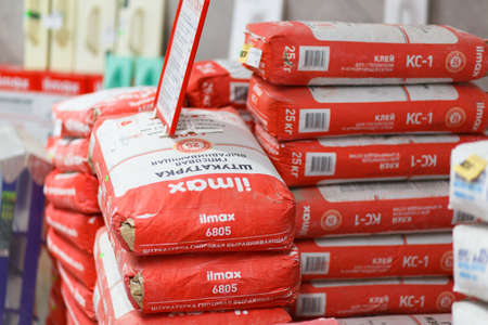 Grodno, Belarus - June 20, 2018: Shelves with dry plaster, cement and putty in a building materials storeのeditorial素材