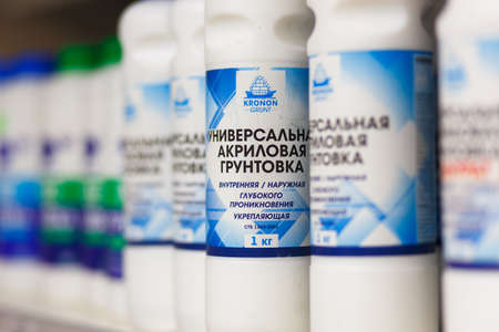 Grodno, Belarus - June 20, 2018: Showcase with primers, paints an other building materials from various manufacturers in the building materials store Alkorのeditorial素材