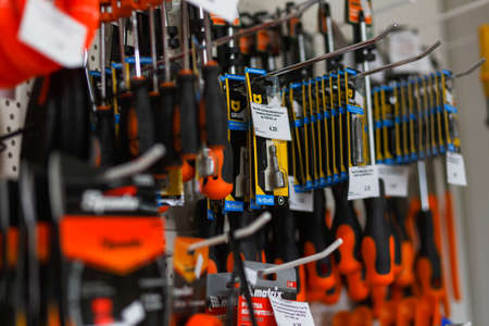 Grodno, Belarus - June 20, 2018: Hand hold Graff drill bits and screwdriver set in the building materials store Alkorのeditorial素材