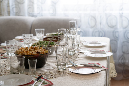 View on the served for family festive dinner table in guest roomの写真素材