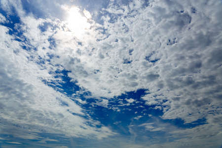 Blue sky background with tiny clouds on a summer afternoonの写真素材