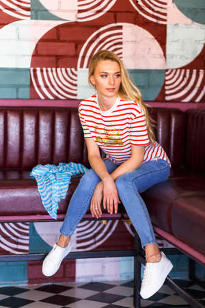 Young pretty woman wearing in casual style resting in cafeの写真素材