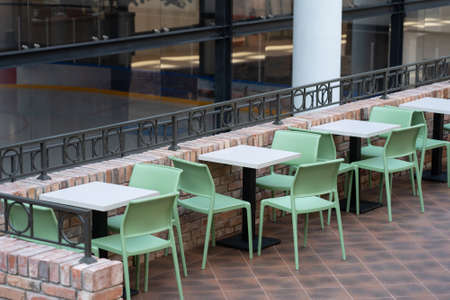Interior of wooden table in food court shopping mall. Food center in department store.の写真素材
