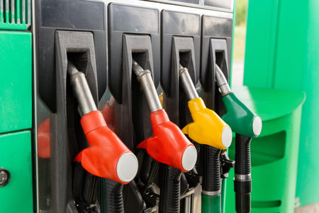 Colorfull fuel gasoline dispenser background. Close up of petroleum gasoline station service - oil...