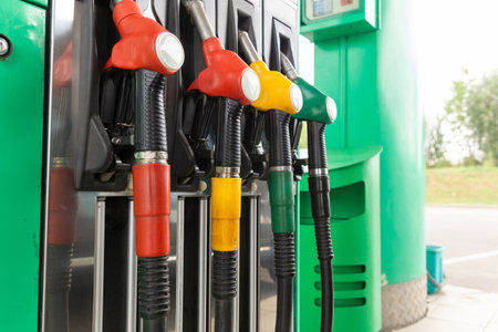 Colorfull fuel gasoline dispenser background. Close up of petroleum gasoline station service - oil refueling and refilling for car transportation conceptの写真素材