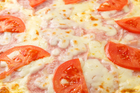 Pizza background - macro shot of italian pizza. It can be used as an abstract food background.の写真素材