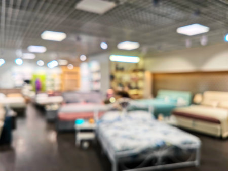 Abstract blur background of family shopping on furniture store sales season - can use to display or montage on product. Abstract blurred furniture home decor store backgroundの写真素材