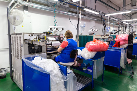Grodno, Belarus - November 22, 2017: Women are engaged in tailoring of tights in JLLC Conte Spa.のeditorial素材