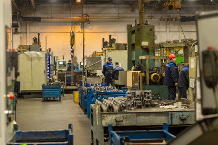Grodno, Belarus - February 15, 2023: Workers work in the workshop for the production of cardan drives on Open Joint Stock Company Belkard. The production is built on the principle of a conveyor.のeditorial素材