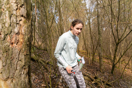Grodno, Belarus - 25 March, 2023: Strong caucasian teenage girl wearing sportswear running through a...