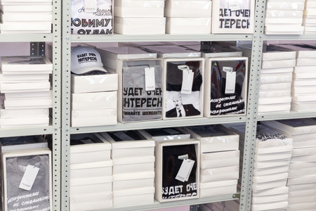 Grodno, Belarus - June 30, 2022: Shelves with packed clothes with quotes of the President lukashenko...
