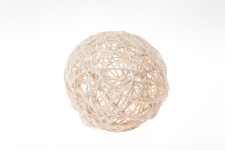 Decorative woven wicker or rattan white ball isolated on white.の写真素材