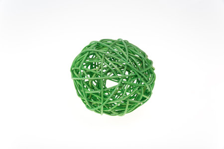 Decorative woven wicker or rattan green ball isolated on white.の写真素材