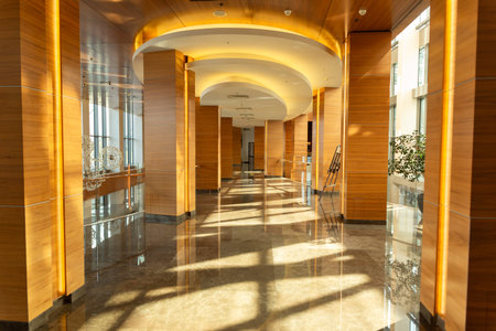 Interior view of gorgeous hotel has wooden balconies and a glazed facade.