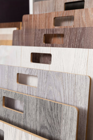 Laminate background. Samples of laminate or parquet with a pattern and wood texture for flooring and interior design. Production of wooden floorsの写真素材