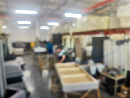 Unfocused background photo of workers assembling upholstered furniture in a factory. It can be used as a background.の写真素材