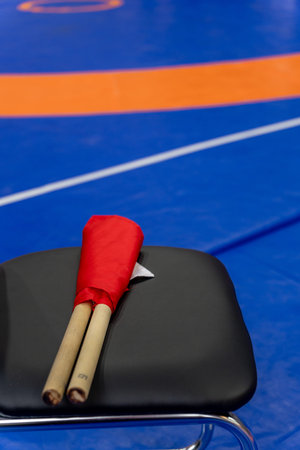The referee's red and white flags are waiting for the referee on the chairs. The concept of the...