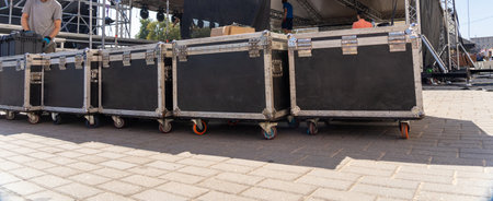 Stage equipment before the concert. Boxes with concert equipment: speakers, lighting, amplifiers, LED panels and cables.の写真素材