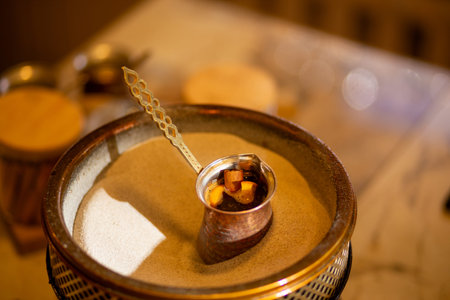 Turkish Sand Coffee making. Preparation of Turkish coffee in the cezve in the sand. Turkish method...