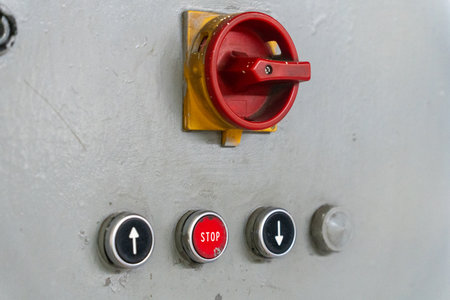 Emergency Stop installed at line conveyor in manufacturing plant. START - STOP button for industrial machine. Industrial and factory concept.の写真素材