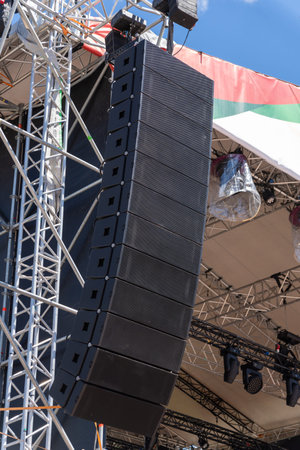 Suspended powerful concert acoustic system on stage for a musical show in the square, ideal for live performances and events.の写真素材