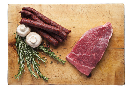 Fresh vegetables and meat on cutting boardの写真素材