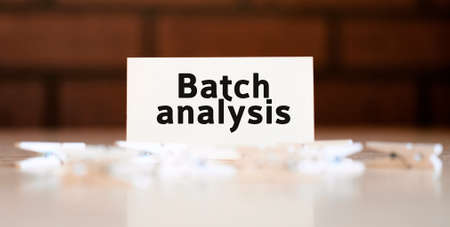 Batch analysis text of business concept on white list and with clothespinsの写真素材