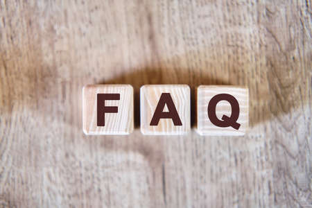 FAQ - text on wooden cubes, on wooden backgroundの写真素材