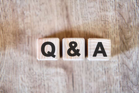 Questions and answer - text on wooden cubes, on wooden backgroundの写真素材
