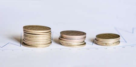 Metal coins are a stack on the growth chartの写真素材