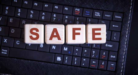 SAFE word concept on cubes on the keyboardの写真素材
