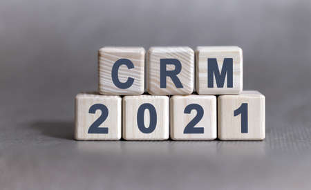 CRM text on wooden cubes on a monochrome backgroundの写真素材