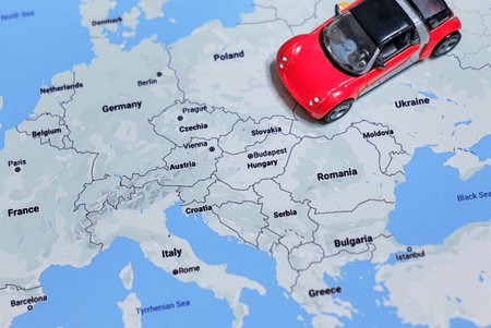 Red car goes on a journey through the cities of Europe