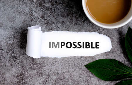 Impossible with cup of coffee and green leafの写真素材