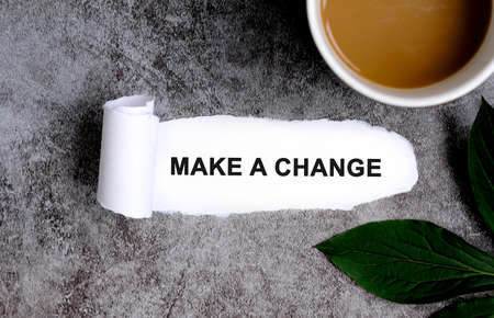 Make a change with cup of coffee and green leafの写真素材